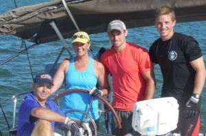 Closeup of Neale and Karen Bennett, with sons Beau and Chase in cockpit of an Offshore Sailing School cruising boat in the British Virgin Islands