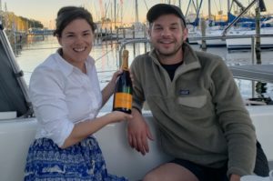 Couple with champagne on a boat