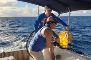 Offshore Sailing School instructor working with crew on quick maneuvers under sail