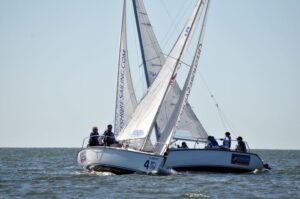Two Colgate 26 sailboats crossing during Performance Racing Clinic at Offshore Sailing School