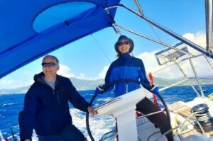 A husband and wife couple learning to cruise on a monohull yacht in the British Virgin Islands