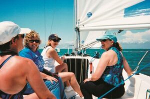 Four women on Offshore Sailing School Colgate 26 learning to sail in Gulf of Mexico
