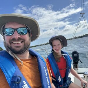 Father and daughter on a sailboat